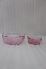 7-piece grey ribbed glass fruit set featuring one large serving bowl and six small bowls with elegant gold rims, displayed on a kitchen counter.