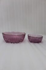 7-piece grey ribbed glass fruit set featuring one large serving bowl and six small bowls with elegant gold rims, displayed on a kitchen counter.
