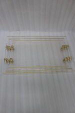 Clear acrylic tray set with textured glass look, gold accents, and transparent handles displayed on a white marble countertop.