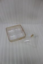 Two luxury clear acrylic dry fruit serving dishes with gold trim, crystal knobs, and partitioned compartments displayed on a modern wooden coffee table.