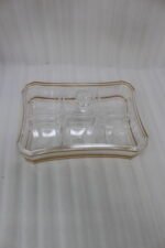 Elegant rectangular crystal dry fruit dish with multiple compartments, gold trim, and a matching lid placed on a wooden table.