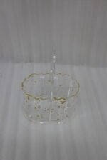 Clear acrylic spoon holder featuring decorative gold flake accents, a convenient top loop carry handle, and organized stainless steel spoons on a kitchen countertop.