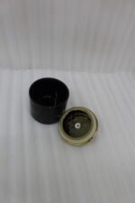 Luxury 3-piece black and gold ceramic storage jar set with golden lids arranged on an elegant gold metal cart stand on a modern kitchen countertop.