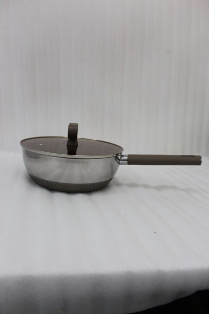 A collection of high-quality titanium stainless steel woks and frying pans in sizes 24cm, 26cm, 28cm, and 30cm with glass lids and ergonomic handles displayed on a kitchen counter.