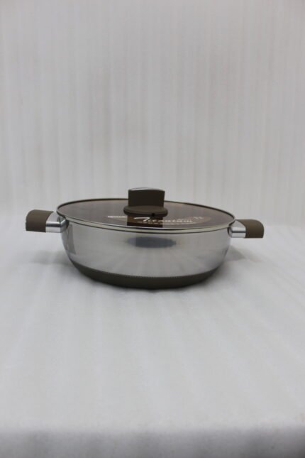 Four stainless steel double-handle woks with glass lids in 24cm, 26cm, 28cm, and 30cm sizes displayed on a dark kitchen countertop.