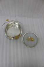 3-piece luxury silver decorative serving dishes with gold floral accents and metallic handles displayed on a wooden coffee table.