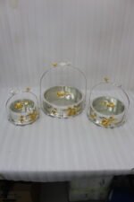 3-piece luxury silver decorative serving dishes with gold floral accents and metallic handles displayed on a wooden coffee table.