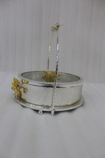 3-piece luxury silver decorative serving dishes with gold floral accents and metallic handles displayed on a wooden coffee table.