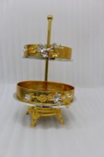 Luxury 2-tier gold decorative serving tray with silver floral accents on a wooden table
