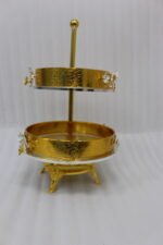 Luxury 2-tier gold decorative serving tray with silver floral accents on a wooden table