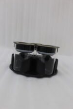 Four modern 6-piece revolving glass spice jar sets with gold trim lids displayed on a white kitchen countertop in beige, cream, black, and white colors.