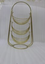 3-tier gold wire decorative metal baskets stand on a wooden table