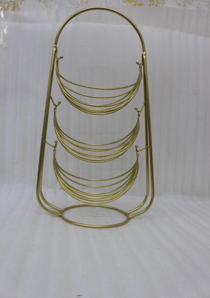 3-tier gold wire decorative metal baskets stand on a wooden table