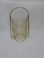 3-tier gold wire decorative metal baskets stand on a wooden table