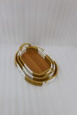 3 piece oval rattan serving trays with handles and wooden bottoms in a two-tone white and natural brown pattern