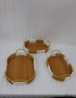 3 piece oval rattan serving trays with handles and wooden bottoms in a two-tone white and natural brown pattern