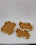 3 piece oval rattan serving trays with handles and wooden bottoms in a two-tone white and natural brown pattern