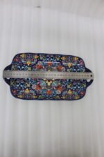 Intricate vibrant blue and yellow Marrakech ceramic serving dish tray with built-in handles on a stone countertop