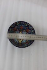 Royal blue handcrafted Marrakech ceramic mug with intricate floral interior pattern sitting on a kitchen counter