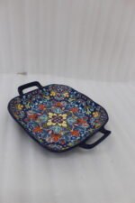 Square ceramic 6-inch Marrakesh decorative bowl with vibrant floral mandala pattern and side handles sitting on a wooden table.