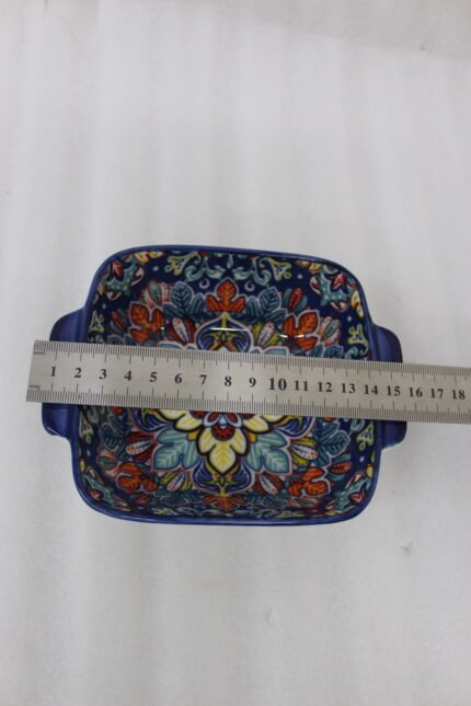 Vibrant blue 9.5-inch decorative Marrakech ceramic serving bowl with handles featuring a colorful mandala pattern on a rustic wooden table.
