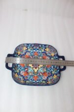 Vibrant blue 9.5-inch decorative Marrakech ceramic serving bowl with handles featuring a colorful mandala pattern on a rustic wooden table.