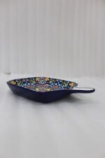 Square 6.5-inch Marrakech ceramic serving dish with colorful mosaic mandala patterns and an integrated handle on a wooden table.