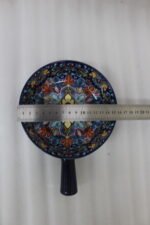 6-inch vibrant blue decorative Marrakesh ceramic bowl with colorful mosaic patterns and side handle on a wooden table.