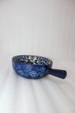 6-inch vibrant blue decorative Marrakesh ceramic bowl with colorful mosaic patterns and side handle on a wooden table.