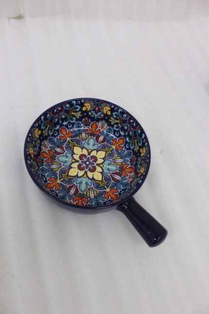 6-inch vibrant blue decorative Marrakesh ceramic bowl with colorful mosaic patterns and side handle on a wooden table.