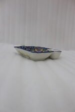 Square hand-painted Moroccan ceramic serving dish with colorful Marrakech floral pattern and built-in dip bowl on a wooden table.