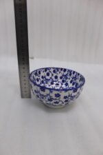 Pair of blue and white handcrafted decorative Marrakesh ceramic bowls in 5-inch and 8-inch sizes on a marble countertop