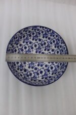 Pair of blue and white handcrafted decorative Marrakesh ceramic bowls in 5-inch and 8-inch sizes on a marble countertop