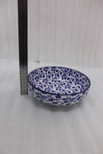 Pair of blue and white handcrafted decorative Marrakesh ceramic bowls in 5-inch and 8-inch sizes on a marble countertop