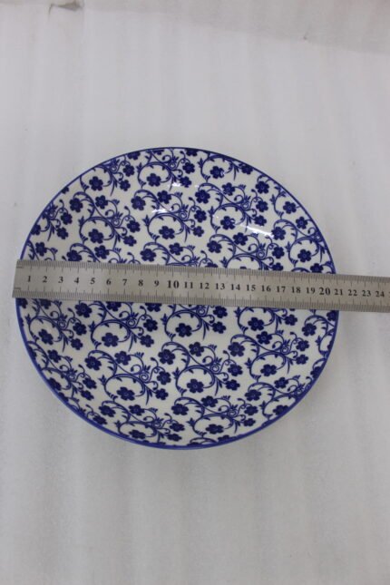 8-inch ceramic decorative Marakesh bowl with intricate blue and white floral pattern resting on a white countertop