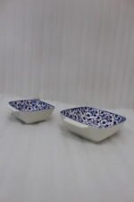 Square ceramic Marrakesh serving dish with blue and white floral pattern resting on a kitchen countertop