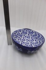 9.5-inch decorative Marrakesh ceramic bowl with blue and white floral pattern on a kitchen counter