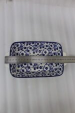 9-inch decorative Marrakech blue and white floral ceramic rectangular serving dish with handles on a wooden kitchen counter