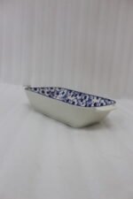 9-inch decorative Marrakech blue and white floral ceramic rectangular serving dish with handles on a wooden kitchen counter