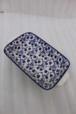 9-inch decorative Marrakech blue and white floral ceramic rectangular serving dish with handles on a wooden kitchen counter