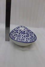 Two decorative Marakesh blue and white floral ceramic serving dishes with handles resting on a kitchen countertop.