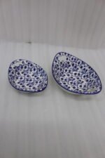 Two decorative Marakesh blue and white floral ceramic serving dishes with handles resting on a kitchen countertop.