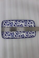Two rectangular blue and white decorative Marrakesh serving dishes in 8-inch and 10-inch sizes displayed on a marble countertop.