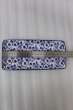 Two rectangular blue and white decorative Marrakesh serving dishes in 8-inch and 10-inch sizes displayed on a marble countertop.