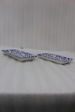 Two rectangular blue and white decorative Marrakesh serving dishes in 8-inch and 10-inch sizes displayed on a marble countertop.