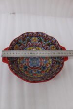 Decorative Marrakesh double handle ceramic serving bowls with colorful Moroccan pattern on a wooden kitchen island