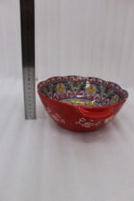 Decorative Marrakesh double handle ceramic serving bowls with colorful Moroccan pattern on a wooden kitchen island