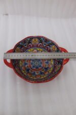 Decorative Marrakesh double handle ceramic serving bowls with colorful Moroccan pattern on a wooden kitchen island