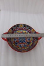 Decorative Marrakesh double handle ceramic serving bowls with colorful Moroccan pattern on a wooden kitchen island