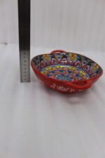 Decorative Marrakesh double handle ceramic serving bowls with colorful Moroccan pattern on a wooden kitchen island